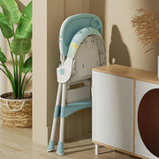 Children's high chair in a room with a plant and cabinet
