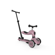 Pink scooter with a black handlebar on a white background