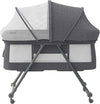 Gray baby crib with mesh sides on a white background