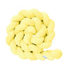 Yellow knitted rope toy on a white background