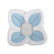 Flower-shaped cushion with blue petals and a gray center on a white background