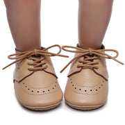 Zapatos de cuero para primeros pasos con suela suave para bebé niño con cordones