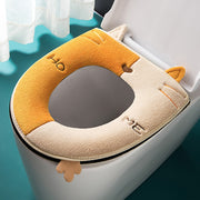 La funda del asiento del cojín del inodoro tiene un mango grueso y bonito con diseño de gato de dibujos animados